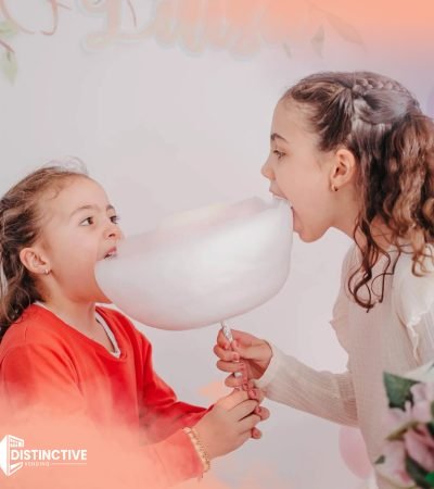 two kids sharing cotton candy