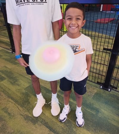 A kid holding cotton candy